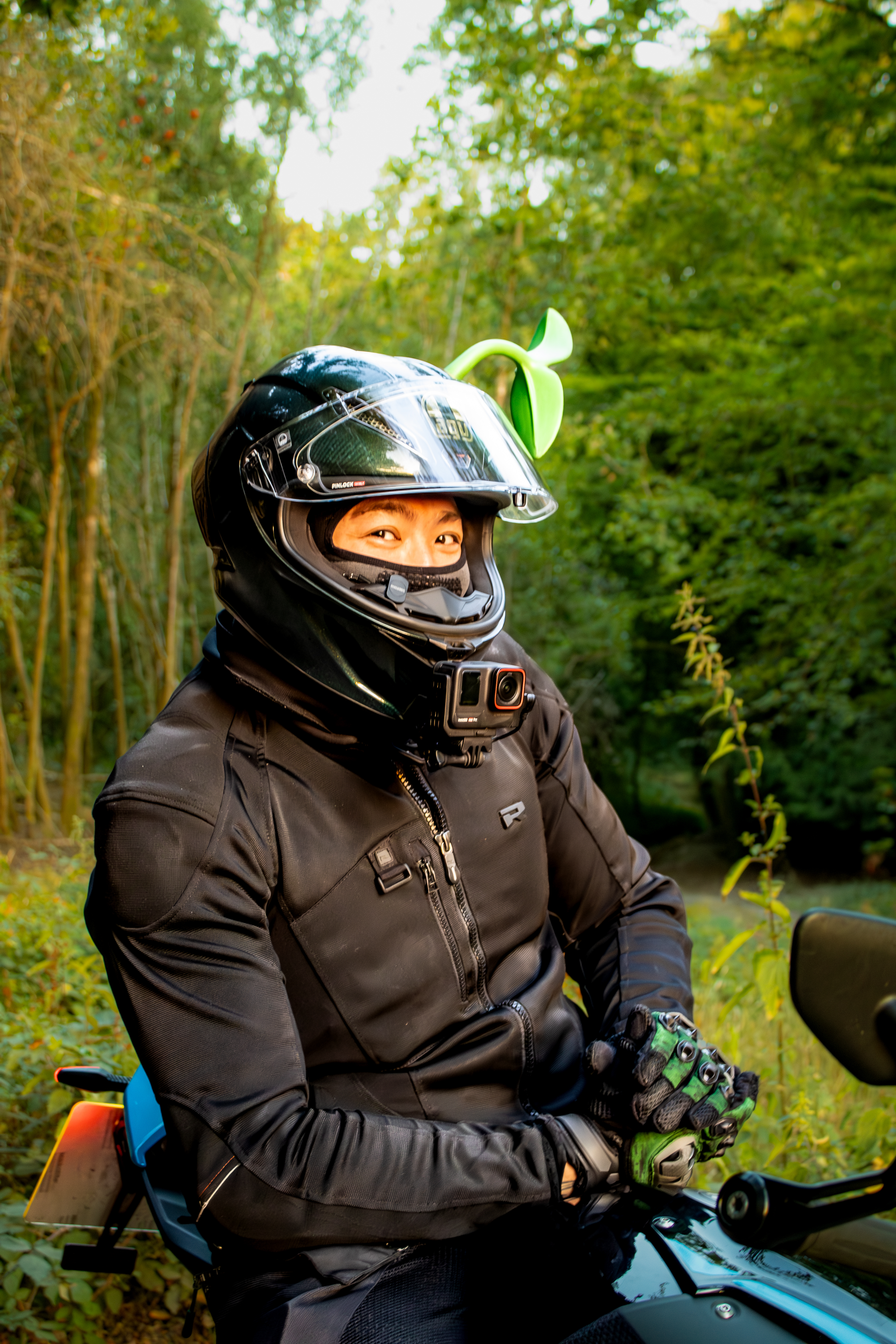 Picture of a man sitting on a bike in a woods